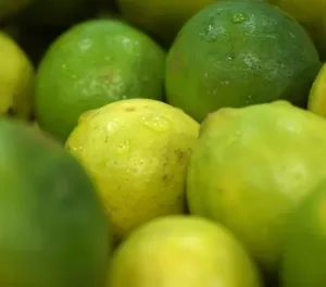 a pile of limes sitting next to each other.